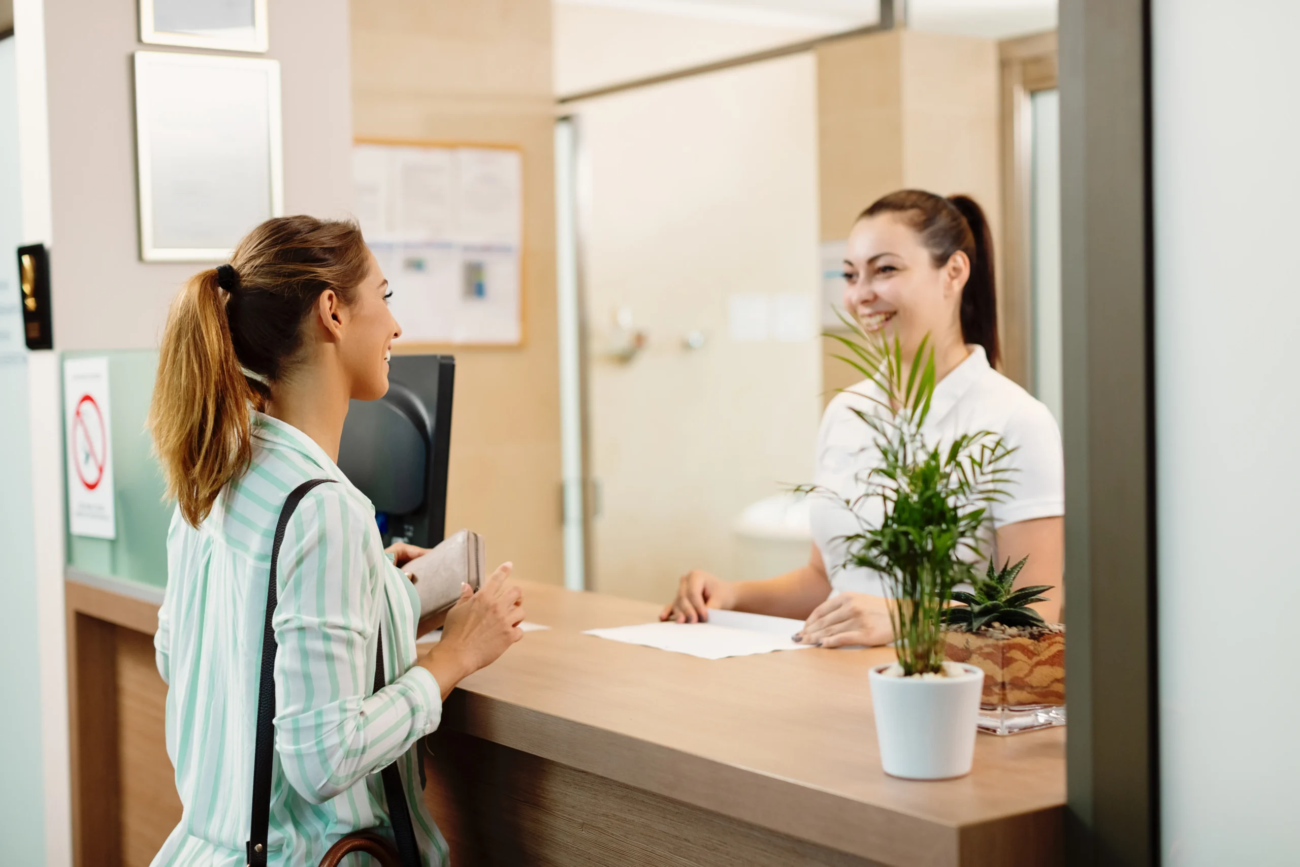 New patient consulting with dental staff in a modern Sherwood Park clinic with a welcoming and organized atmosphere.